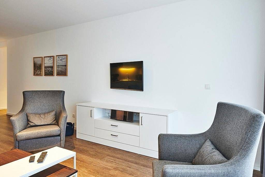 Strandnahes, modernes Apartment mit Westbalkon inkl. Schwimmbad- & Saunanutzung — Bild 2