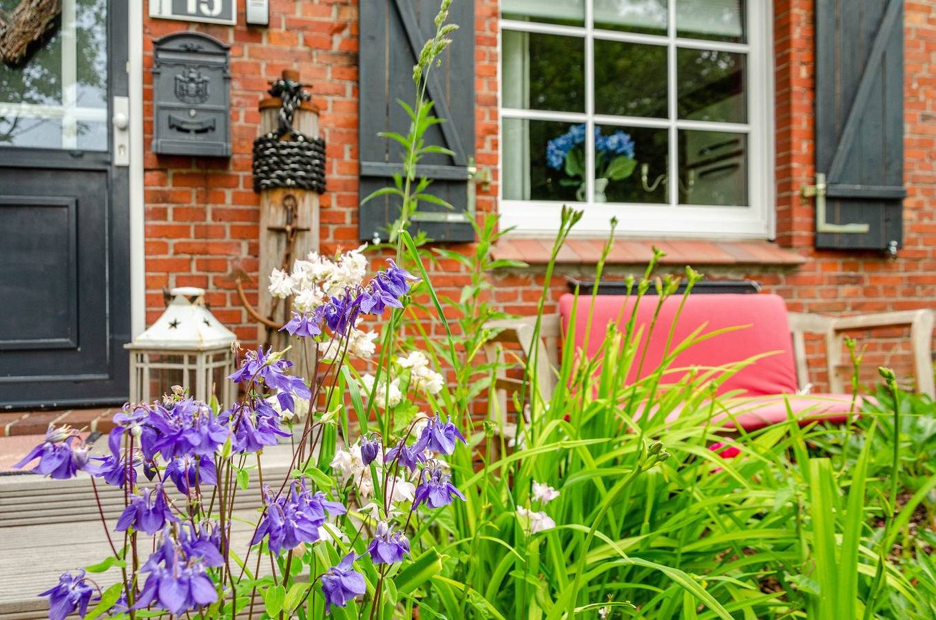 Ferienhaus "Huus Ant Dörpsdiek" mit Privatterrasse, Gemeinschaftsgarten und Wlan