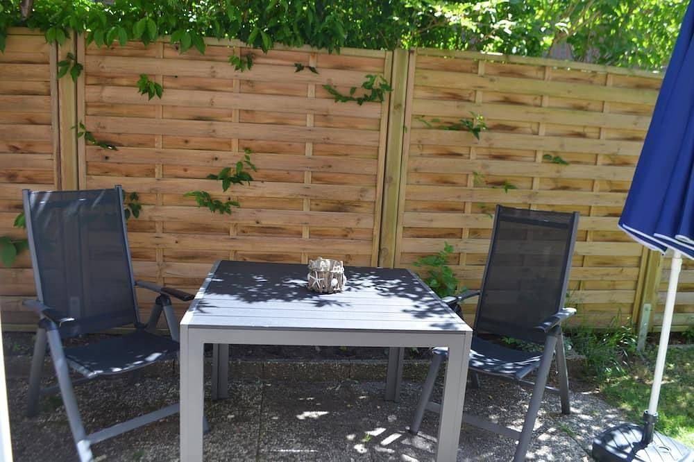 Modern eingerichtete, ebenerdige Wohnung mit Garten, ideal für junge Familien. — Bild 2