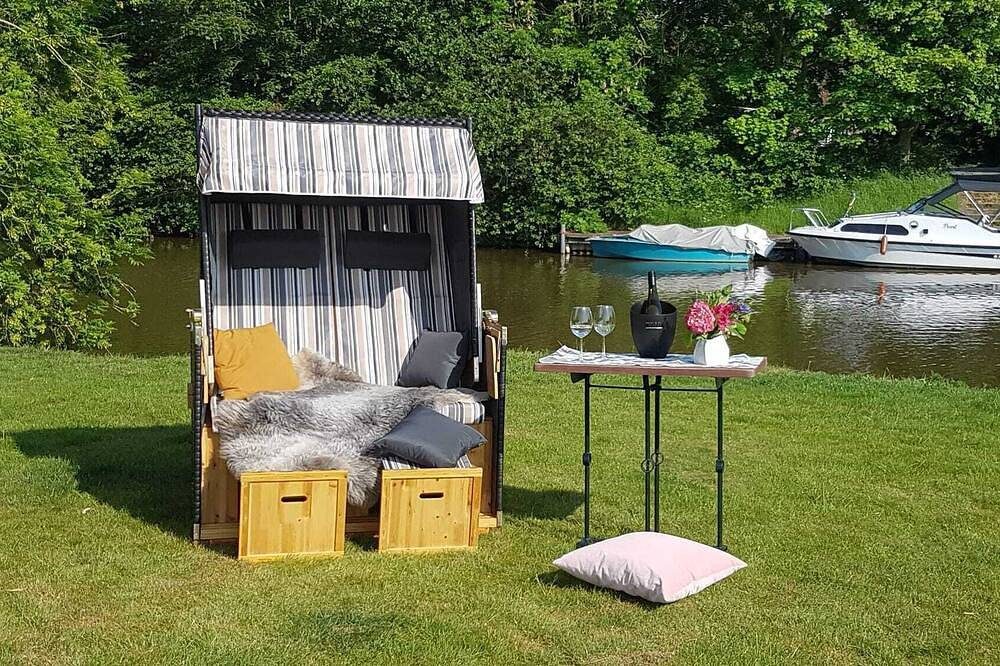 Familienfreundliche Erdgeschosswohnung mit großzügigem Garten und Wasserzugang