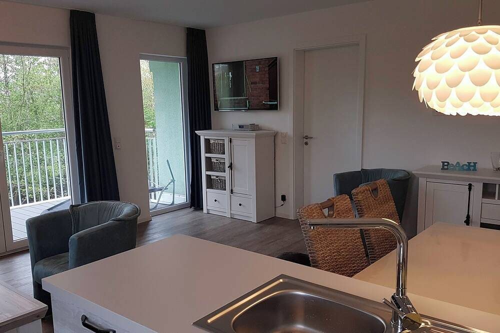 Apartment mit 2 Schlafzimmern, offener Küche, Wohnbereich und Wellnessbad. — Bild 5