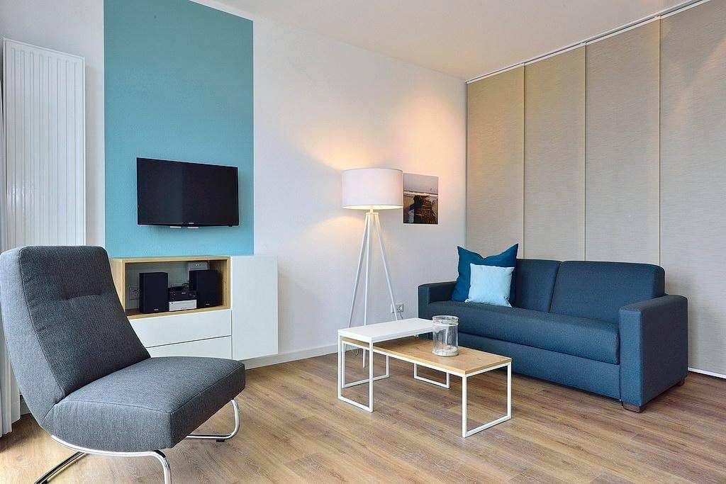 Modernes Apartment an der See mit Westbalkon, Meerblick und Saunabereich im Haus