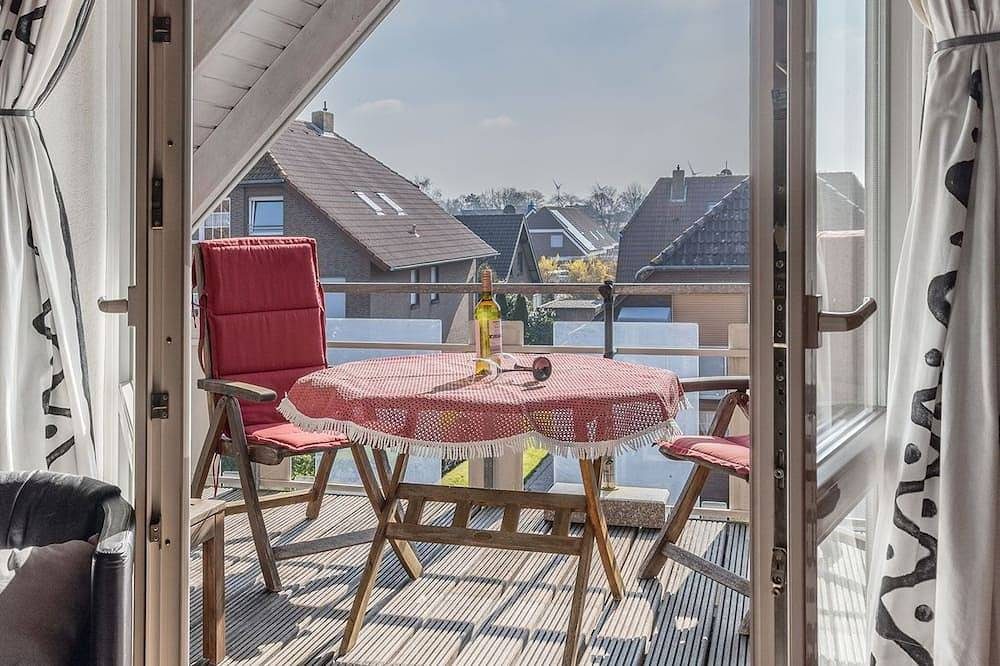 Das einfach ausgestattete Appartement Am Seestern Carolinensiel erwartet Sie mit einem Balkon, einem