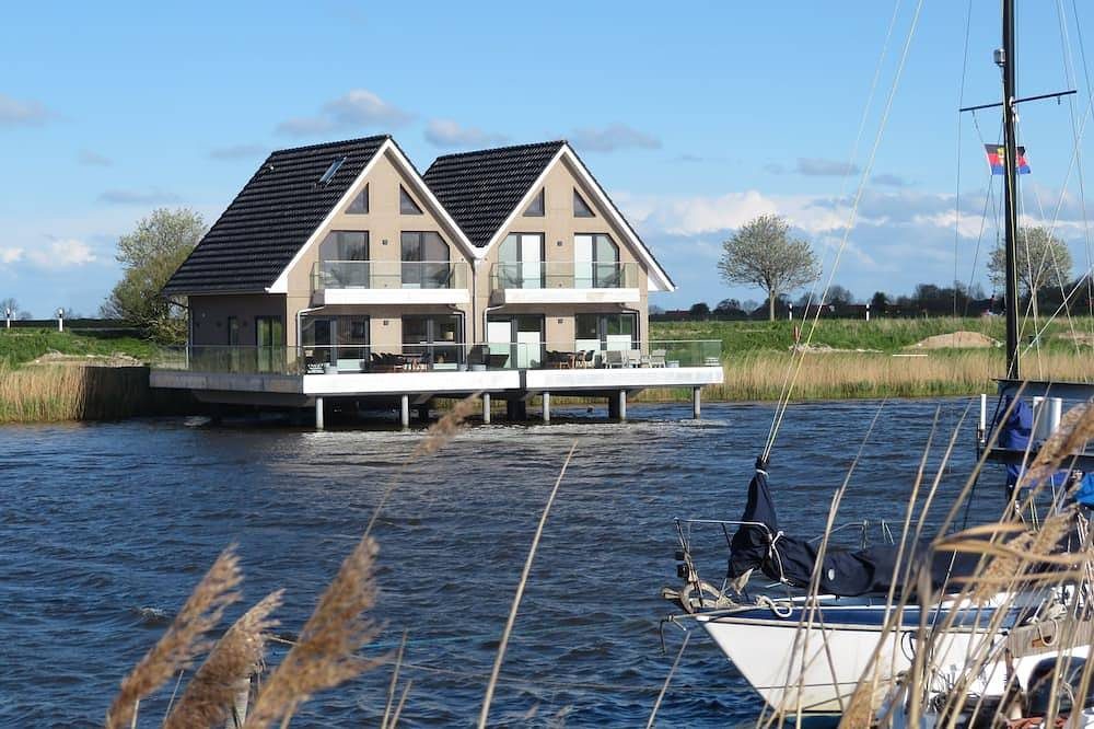 Pfahlhaus Perle am Yachthafen Carolinensiel Harlesiel ??, Wohnen auf dem Wasser